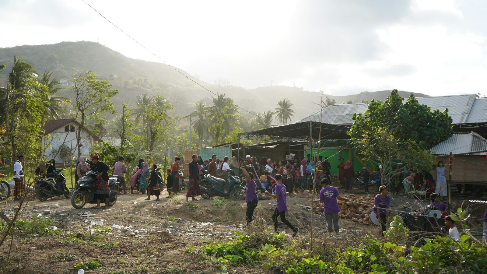 A group of people standing around a village